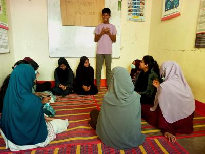 Arman, conducting a child rights awareness session for peers in Chattogram, advocating against child marriage and child labour.