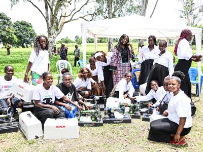 Young girls after receiving sewing machines
