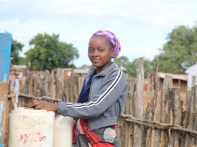 Ana fetching water from a nearby source