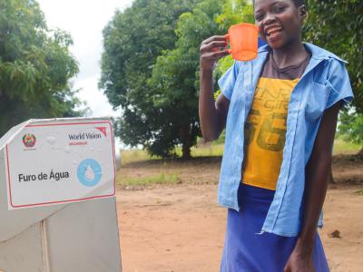 Cecília drinks clean water piped from a new borehole at her school in Zambézia province, central Mozambique