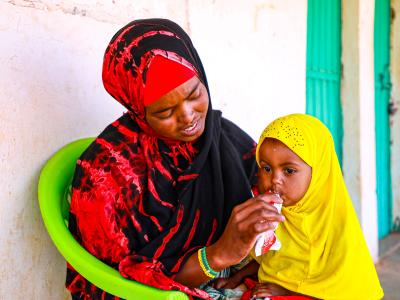 Umul and Sefa eating RUTF
