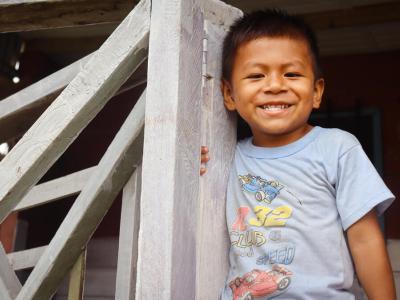 A child from Bolivia smiling at the camera