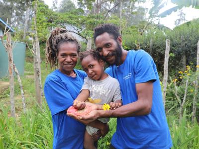 Holding rice seeds from their harvests; a symbol of hope, growth and promising future.