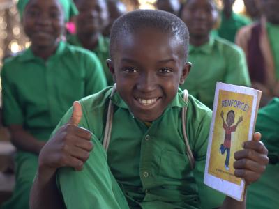 Child holding a book about the EWV approach
