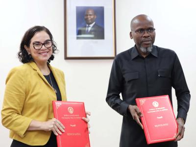 On the right, World Vision Mozambique Country Director stands with the Attorney General's Office Secretary after the signing of the MoU.