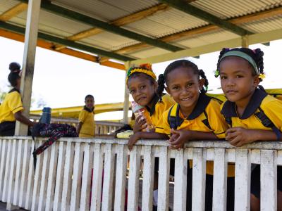 School children walking to Kupiano Elementary School from surrounding communities in Abau District