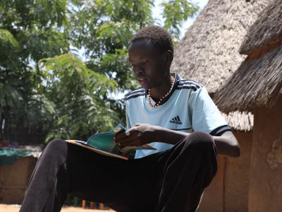 Chankos reading his book at home