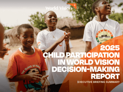 Children participate in a community activity outdoors, standing together and clapping. The image appears on the cover of the 2025 Child Participation in World Vision Decision-Making Report: Executive Briefing Summary.