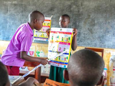 Children In class using the ICE materials Provided by World Vision Uganda