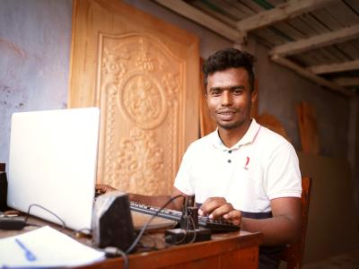 Shahin, a 24-year-old at his workstation. 