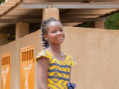 A little girl from Burkina Faso smiling at the camera