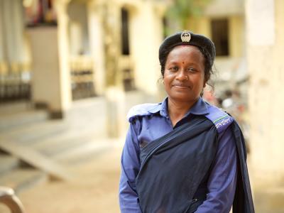 Sumina stands proudly in her village police uniform in Dinajpur, Bangladesh.