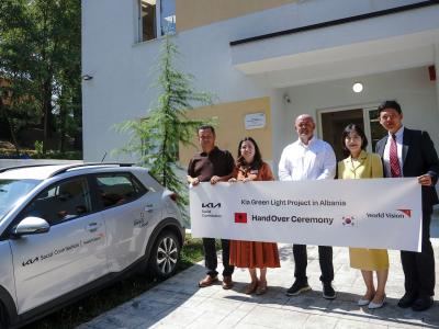 Officials pose for a commemorative photo during Kia's Green Light Project handover ceremony held in Librazhd, Albania, on July 29