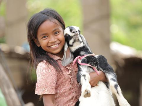 Khmer girl holding goat