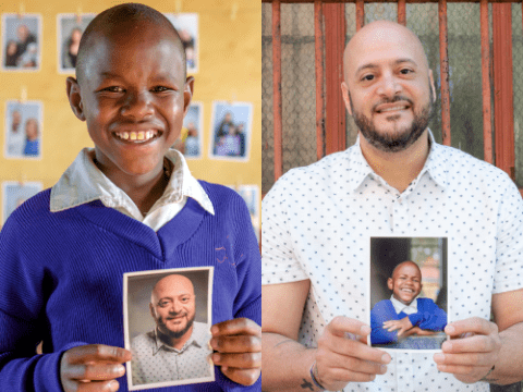 Collins and Joel hold each other's images