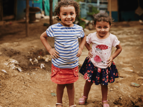 Sisters power pose in Colombia