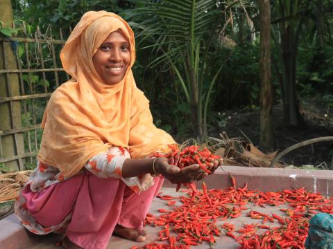 Women's economic empowerment - woman holding chillies