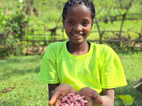 Thanks to the transformative impacts of Farmer Managed Natural Resources (FMNR) practices many families are witnessing a remarkable turnaround in their lives. A young girl in Ethiopia shows some of the harvest