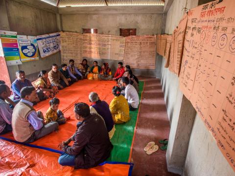 Parents, health care providers, teachers, religious leaders, and local politicians gather to evaluate their local government health clinic and advocate for necessary improvements.