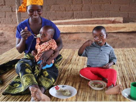 Juvencio eats nutritious food with his little sister