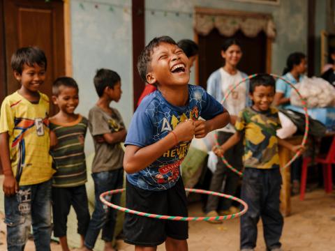 A sponsored child from Cambodia playing