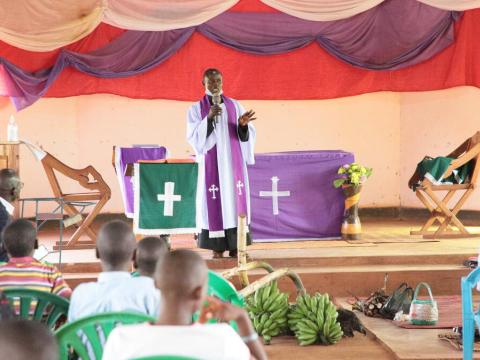 Rev, Jackson leading a church service