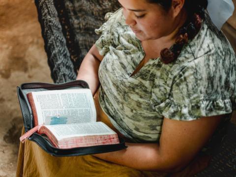 Young woman reading the bible 
