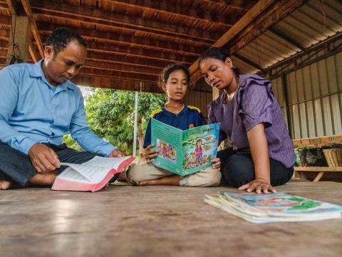 A family doing homework together 