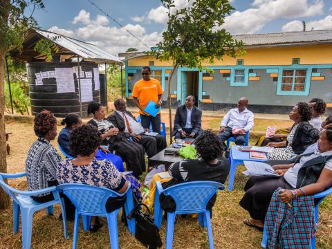 A group of parents receiving celebrating family training 