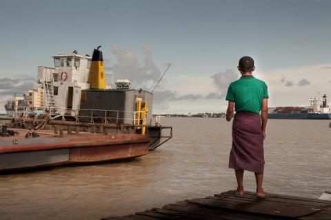 Myanmar man stands on the dock
