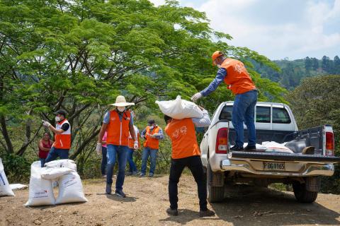 World Vision stff unload supplies from a truck