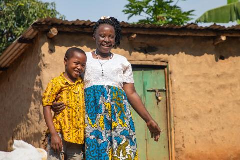 Javira and his grandmother Dinah outside their home
