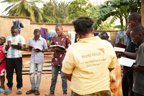 In Beni DRC, orphaned children participate in one of 120 Bible reading clubs supported by World Vision, where they find comfort and hope through sharing and meditation.
