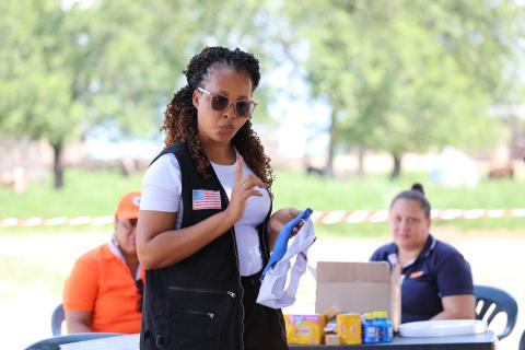 Humanitarian worker from World Vision instructing beneficiaries on how to use reusable sanitary pads.