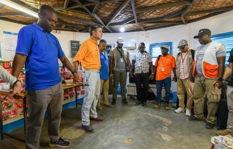 Edgar Sandoval Sr, WVUS President and CEO, prays with World Vision Chad staff who serve Sudanese refugees.