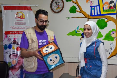 Sarah receiving psychosocial session at the child friendly spaces