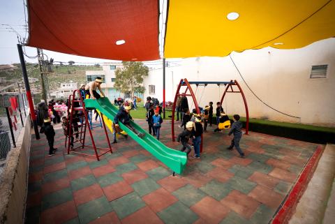 Children are playing in the new palyground