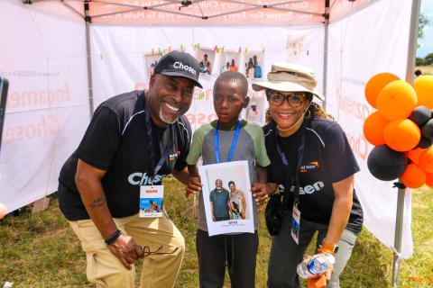 Pastor Mark and his wife, Margo, pose for a photo with the child who chose them.