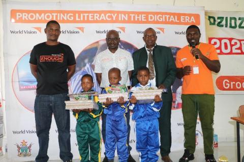 Children winning stationery after participating in the competitions.