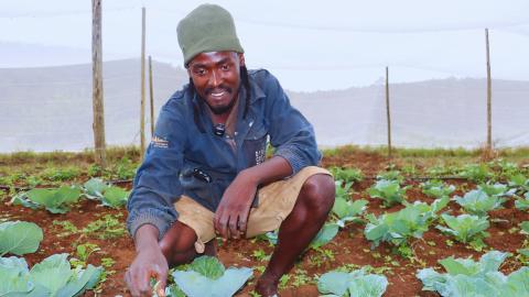 A farmer wielding his garden. 