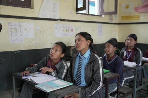 Asta in her classroom alongside friends, concentrating on her studies. (© 2026 World Vision International Nepal/Deepshikha Shrestha)