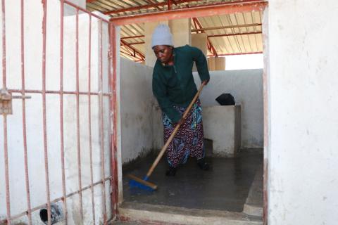 Jacque cleaning the pigsties