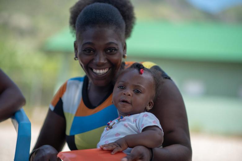 Mother and infant at Go Baby Go training in Haiti