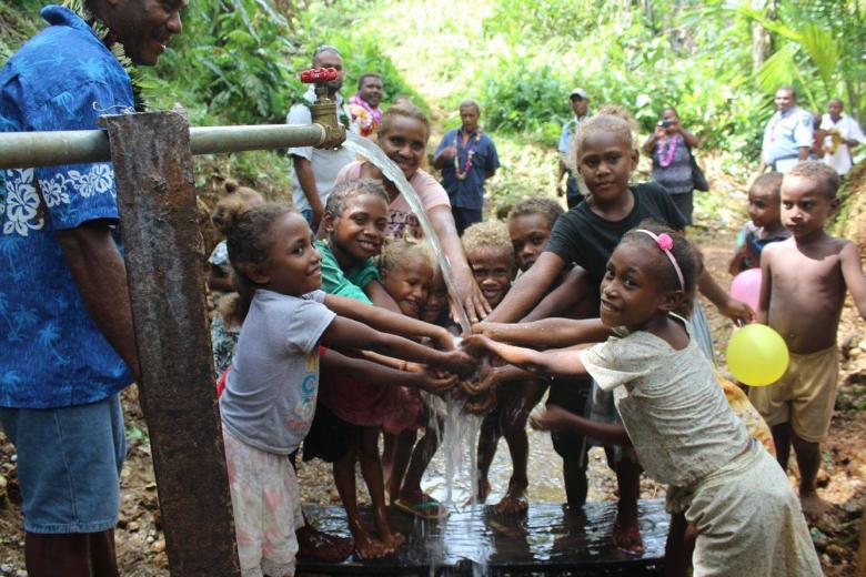 Children around water clean water pipe