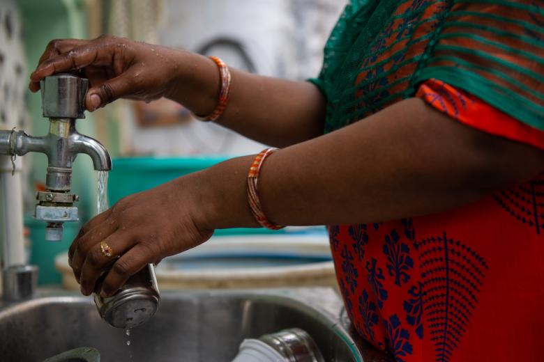 Indian woman with clean water