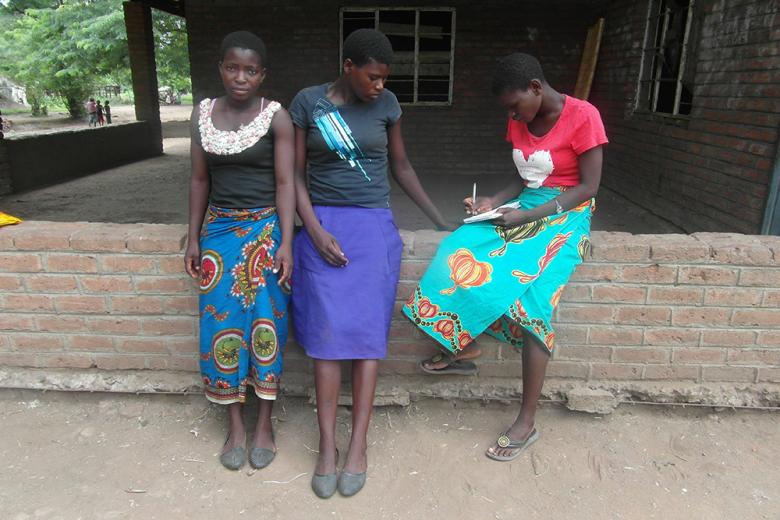Dorthy, in red Blouse, in company of her friends
