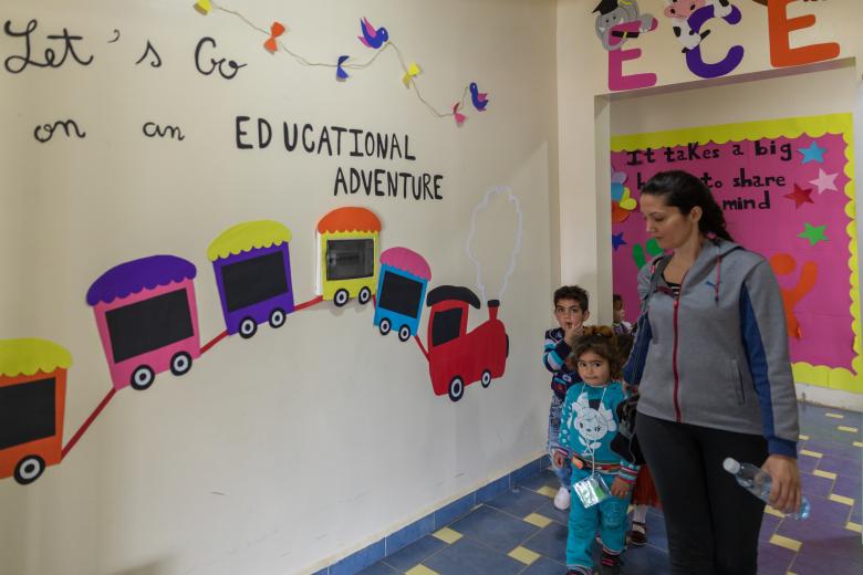 Syrian refugee children going to their classes in the ECE center