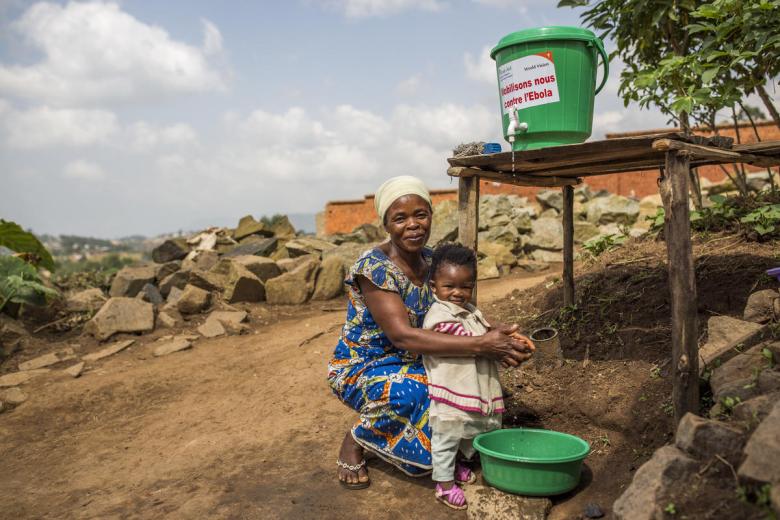 Child orphaned by Ebola washes her hands