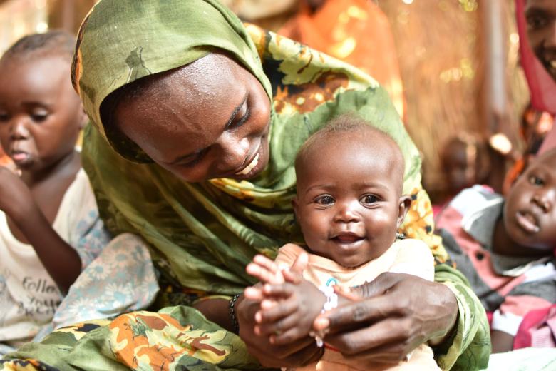 Mashier enjoys plays time with her child, pictured here at the GBG make shift centre.