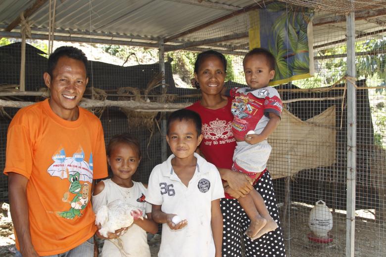 Alarico and Alzira with their children, Fersilia (aged eight), Bruno (aged 13) and Antonio (aged four) in front of their chicken coop. Photo: Jaime dos Reis/World Vision